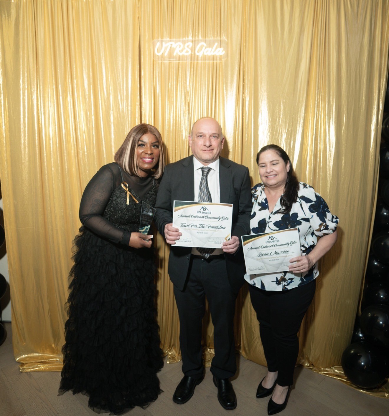 Award recipients holding their certificates at the Gala