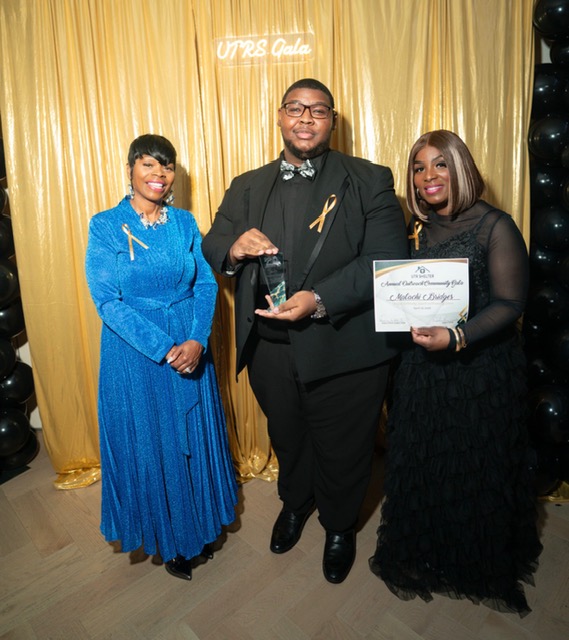 An honoree receiving an award at the Gala