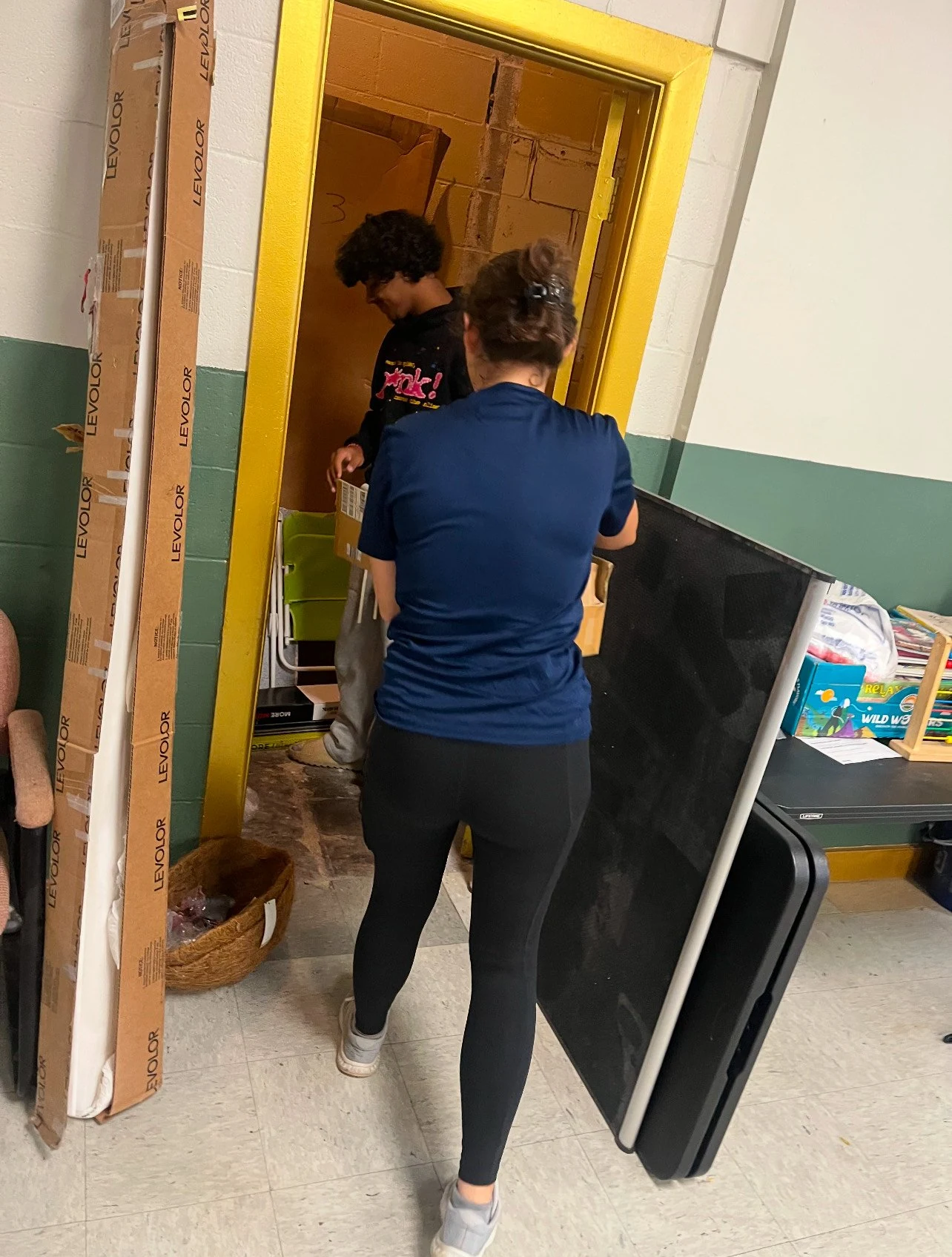 Volunteers sorting donated supplies for guests of the Upon This Rock warming center